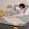Woman reading book on a mattress