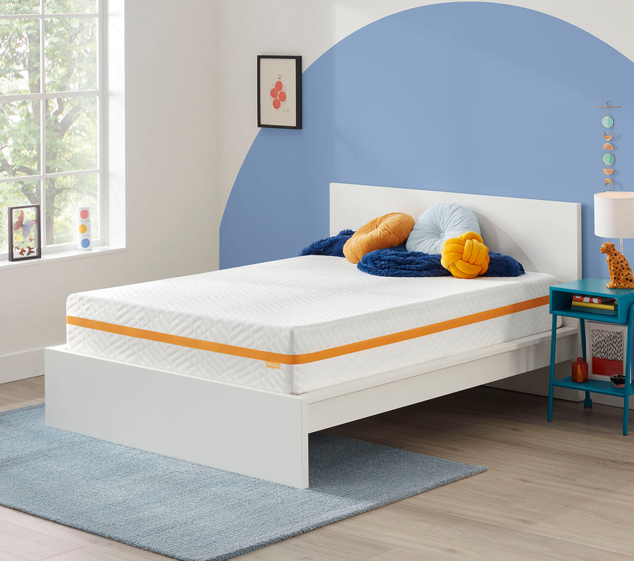 Plush Memory Foam Mattress in a room next to a nightstand