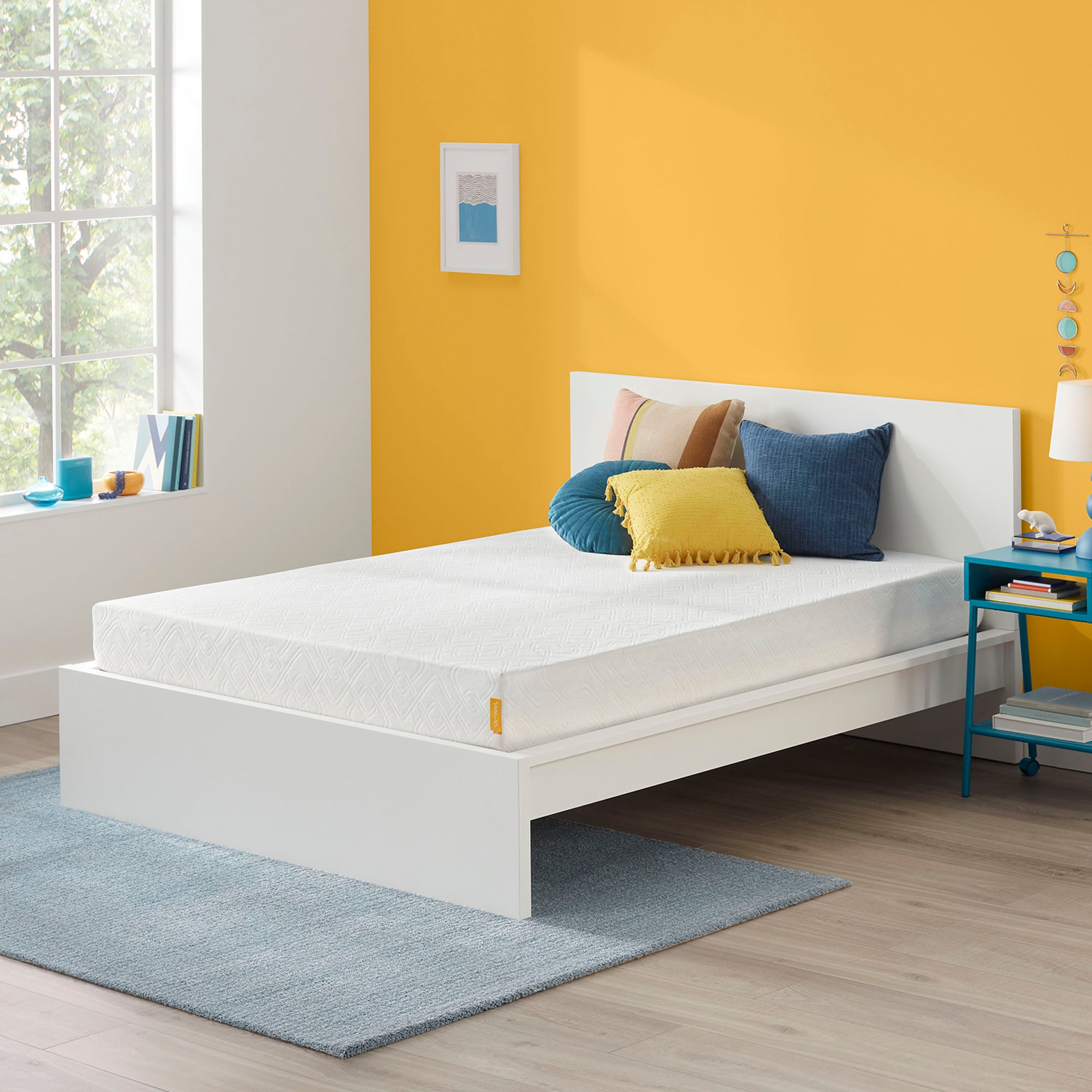 Firm Memory Foam Mattress in a room next to a nightstand